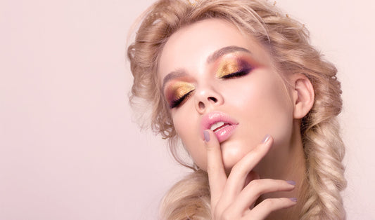 beauty young woman with fishtail braid and creative makeup