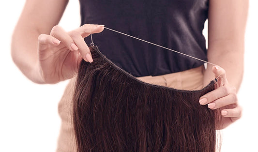 a lady is showing one set of halo hair extensions